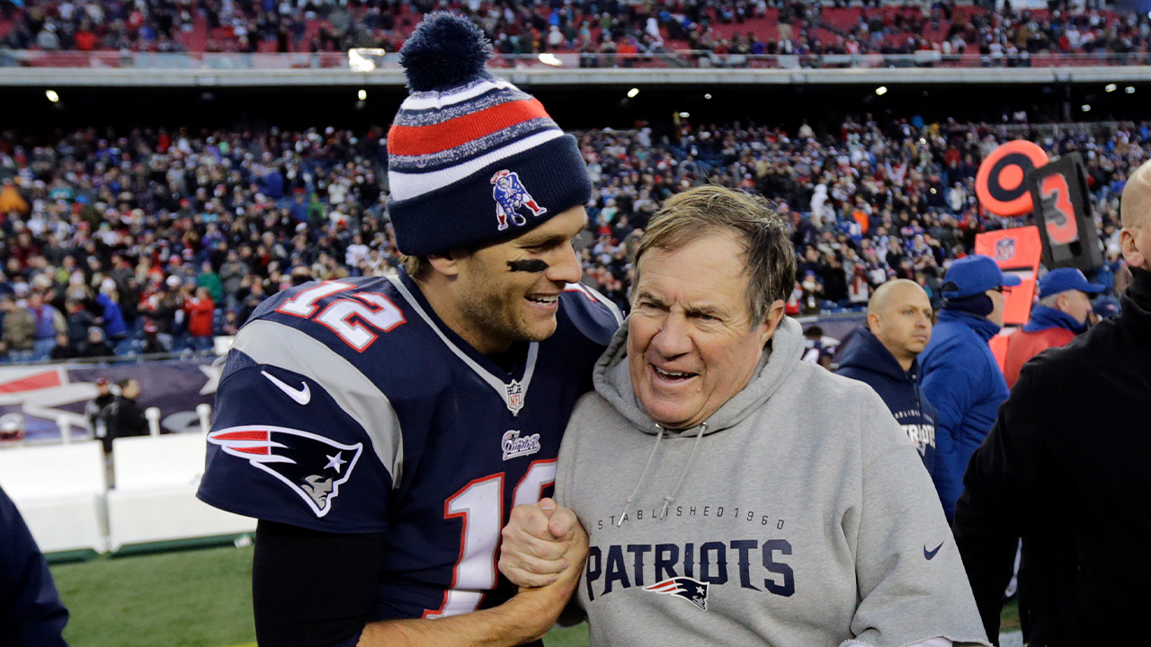 Patriots quarterback Tom Brady, left, celebrates with head coach Bill Belichick after defeating the Miami Dolphins 41-13 on Sunday, Dec. 14, 2014, in Foxborough, Mass.